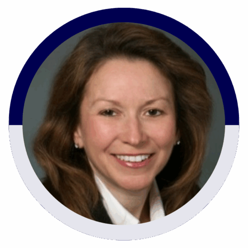 Professional headshot of a woman smiling in business attire