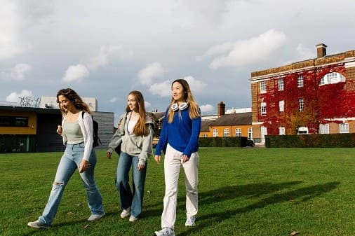 Goldsmith Student Walking Big Green
