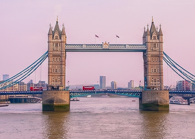 Tower Bridge in London, captured by James Ross, showcasing its iconic structure against a clear blue sky.